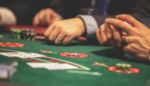 pexels-drew-rae-1871508 (1) Hand of Blackjack players at the casino table